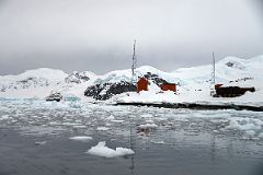 05D The Buildings Of Almirante Brown Station From Zodiac With Quark Expeditions Antarctica Cruise Ship Below Mount Hoegh